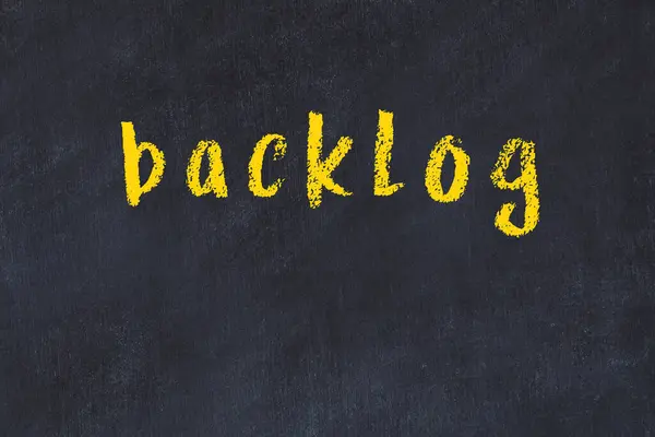 College chalk desk with the word backlog written on in — Stock Photo, Image