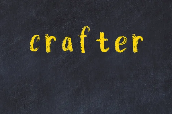 College chalk desk with the word crafter written on in — Stock Photo, Image