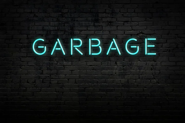 Neon sign. Word garbage against brick wall. Night view — Stock Photo, Image