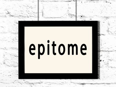 Beyaz tuğla duvarda asılı siyah çerçeve.