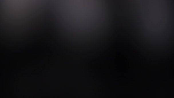 Abstract Glowing White Light Leak On Dark Black Background Stock