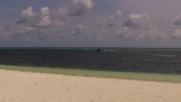 Daytime scenery of idyllic coastline beach lifestyle by blue green water and clean sand background after sunrise — Stock Video