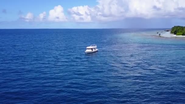 Daytime scenery of idyllic island beach holiday by blue green ocean and bright sand background near resort — Stock Video