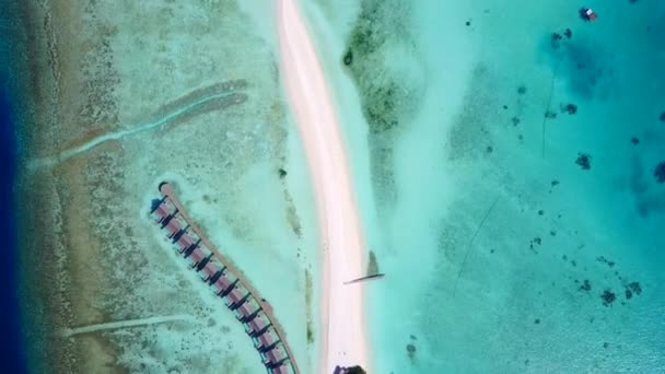 Wide angle sky of marine coastline beach break by blue lagoon with white sandy background near reef — Stock Video