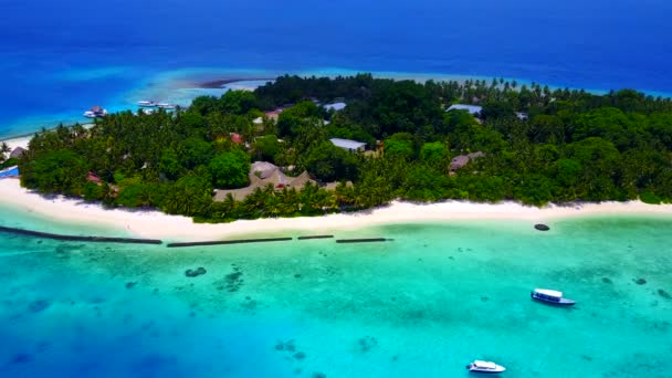 Wide angle panorama of idyllic resort beach break by shallow lagoon with white sandy background near resort — Stock Video