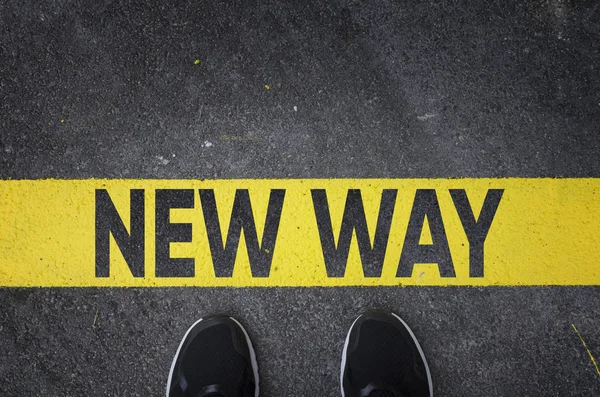 Sneakers Asphalt Road Yellow New Way Line Top View — Stock Photo, Image