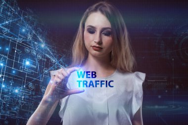 İş, teknoloji, Internet ve ağ kavramı. Geleceğin sanal bir ekranda çalışan genç bir girişimci ve yazıt görür: Web Trafik