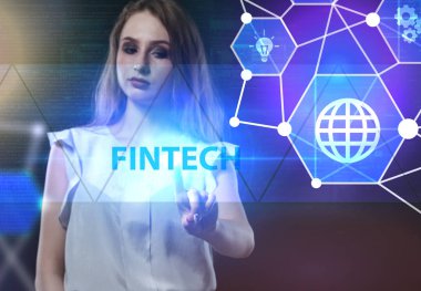 İş, teknoloji, Internet ve ağ kavramı. Geleceğin sanal bir ekranda çalışan genç bir girişimci ve yazıt görür: Fintech