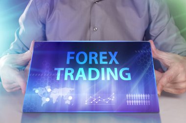 İş, teknoloji, Internet ve ağ kavramı. Geleceğin sanal bir ekranda çalışan genç bir girişimci ve yazıt görür: Forex trading