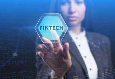 İş, teknoloji, Internet ve ağ kavramı. Geleceğin sanal bir ekranda çalışan genç bir girişimci ve yazıt görür: Fintech