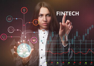 İş, teknoloji, Internet ve ağ kavramı. Geleceğin sanal bir ekranda çalışan genç bir girişimci ve yazıt görür: Fintech