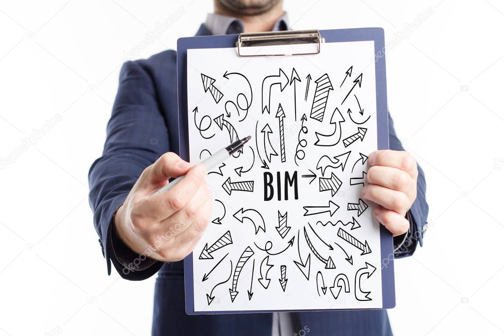 Business, Technology, Internet and network concept. Young businessman shows the word: BIM