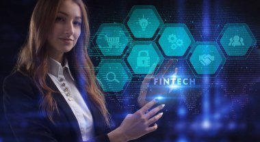 İş, Teknoloji, İnternet ve ağ konsepti. Genç işadamı geleceğin sanal ekranı üzerinde çalışıyor ve Fintech yazısını görüyor.