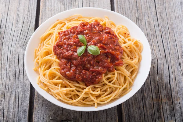 Italian pasta spaghetti with tomato sauce and basil