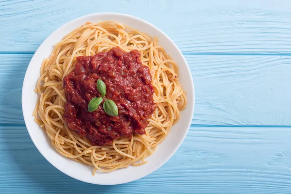 Italian pasta spaghetti with tomato sauce and basil