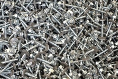 Bir sürü çivi, cıvata, vida bir arka plan oluşturmak için