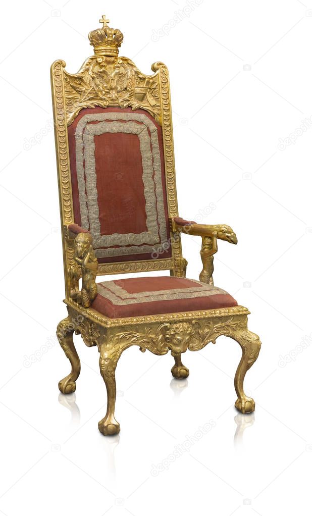 Ancient golden armchair decorated with winged lions isolated on white background. Design element with clipping path