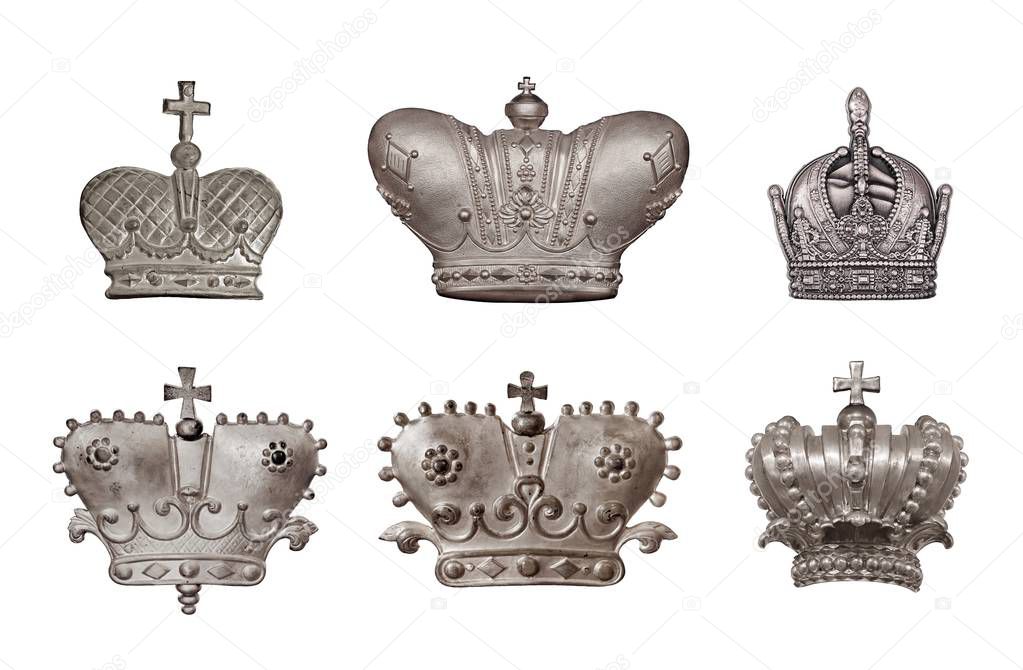Set of silver crowns isolated on white background