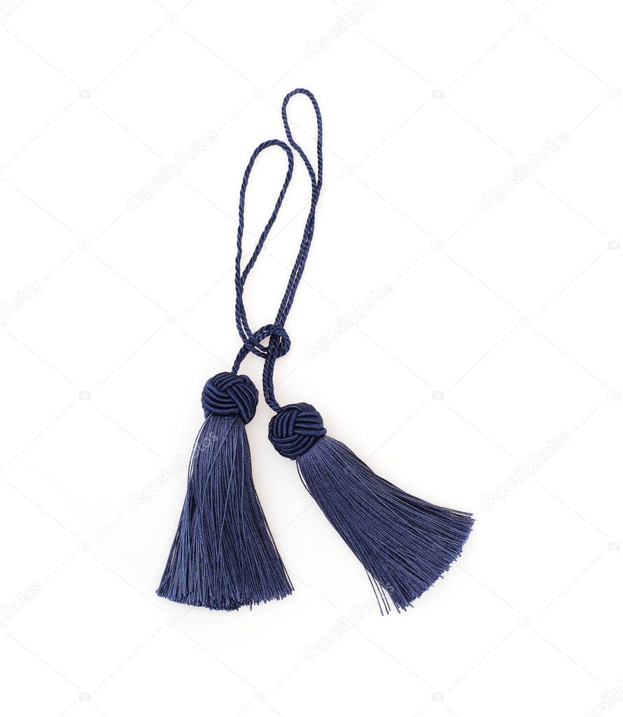 Two blue silk tassels isolated on white background for creating graphic concepts
