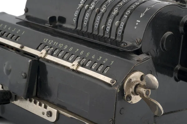 Manual calculating machine (manufactured in 1929) isolated on a white background