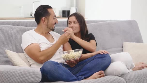 Happy Couple Sofa Eats Popcorn Watch — Stock Video