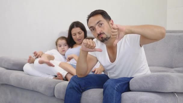 Sad Husband Front Shows Thumbs His Wife Two Kids Back — Stock Video