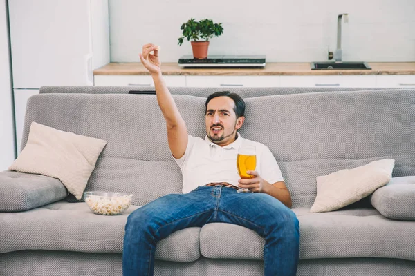 stock image Man with beer and popcorn