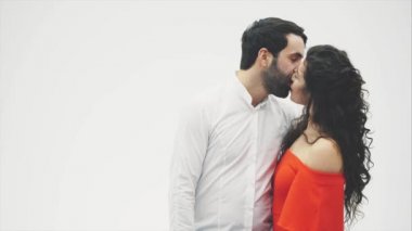 Kissing a pair of stays on a white background. from the heart of the balloon. Valentines Day. Funny lovers.