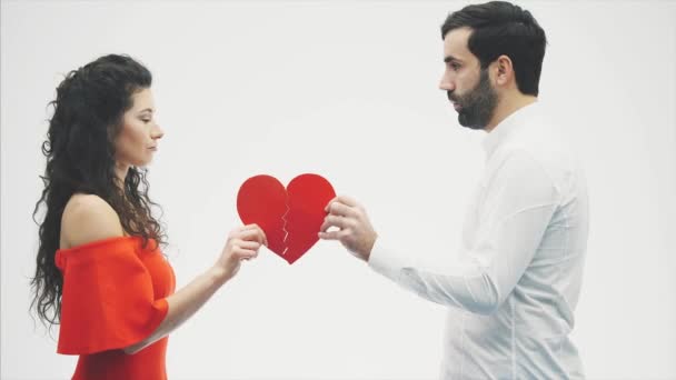 Man Woman Hold Two Halves Broken Heart White Background Concept — 图库视频影像