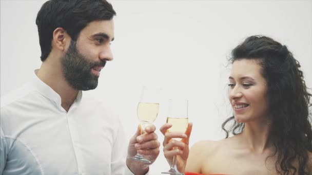 Two beautiful young attractive stylish people. Chic elegant funny positive people. Hold hands in a glass of champagne. — Stock Video