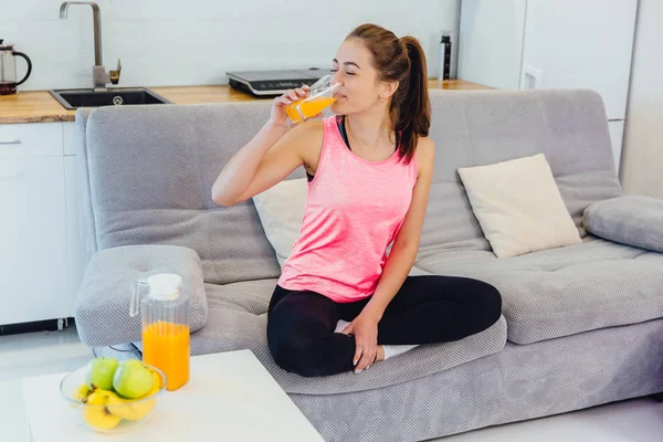 A young girl adheres to the rules of nutrition. Eating fresh fruit and juice.