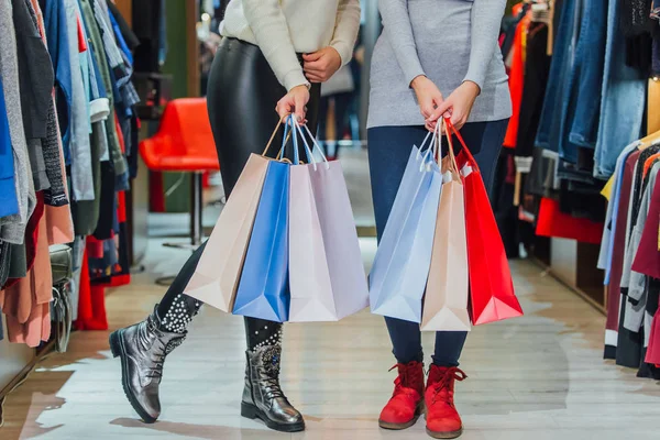 Happy women with shopping bags in the store — Stock Photo, Image