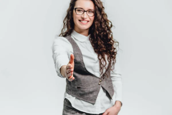 Funny portrait of an excited woman in glasses sunglasses. Close-up of a portrait of a young professional business woman makes the expression a funny face isolated on white background. Ready to