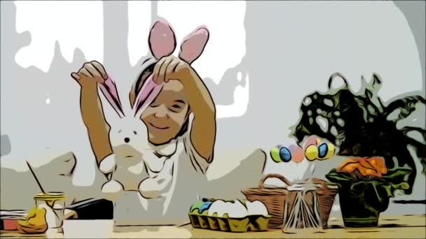 Маленька мила дівчинка весело малює з великоднім кроликом, який має такі ж вуха, як і у неї. Усміхнена дівчина розширює вуха кроликів, а потім обіймає їх. Дівчина з красивим місцем на її обличчі і — стокове відео