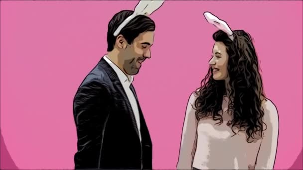 Young sexy couple on pink background. With hackneyed ears on the head. During this man gives a soft toy hare and colored decorative eggs to his wife. Having kissed looking at the camera. Easter — Stock Video