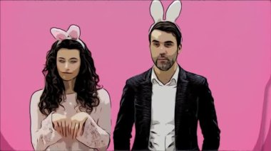 Genç güzel, pembe bir arka plan üzerinde yaratıcı çift duran ihale. Aynı zamanda, dalga bunnies hareketleri gösterir. Paskalya. Animasyon.