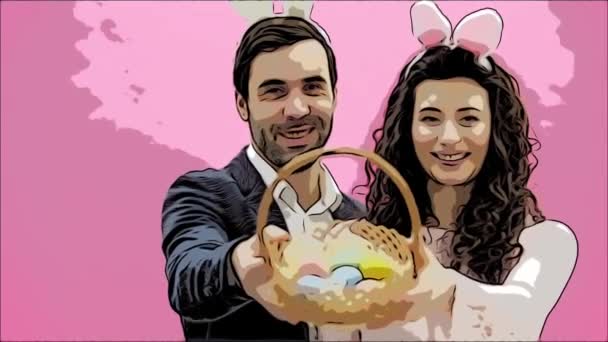 Young couple standing standing on pink background. With a bunny ears on the head. During this man and his wife are looking into the camera. Picking up the Easter basket, look at him and kiss his wife — Stock Video