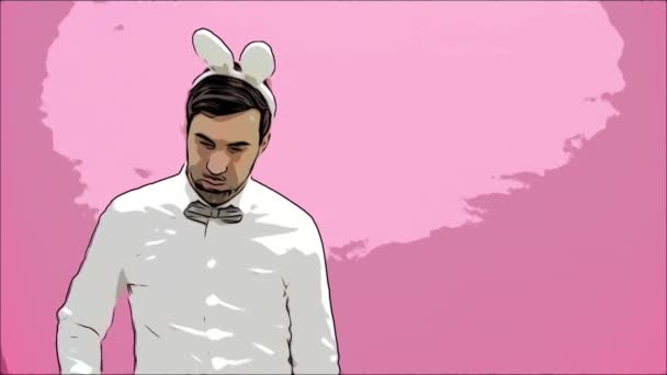 Young man standing on a pink background. With a rabbit ears. Carrots are put in the mouth and set fire to the ashtray. Easter. — Stock Video