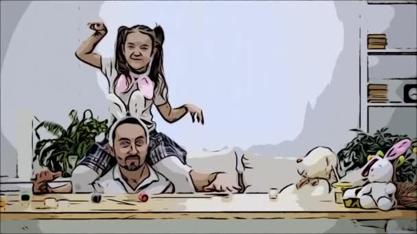Happy and cheerful daughter is sitting on her fathers shoulders and dancing. Father is sitting under the wooden table, where there are a few colorful paints. Father is moving in a time with his — Stock Video
