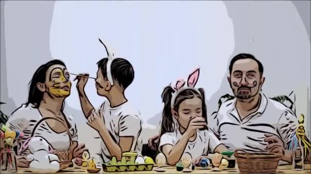 Los padres con sus niños enérgicos y pequeños, se colorean entre sí, sentados en la mesa de madera, llenos de decoraciones de Pascua. Vídeo animado. Atrapar . — Vídeo de stock