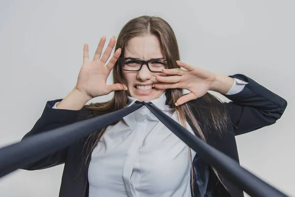 Brown-haired businesswoman is shocked and attracted with blue neacktie. She is touching her face with two hands. Overwhelmed. Deadline. Irritated businesswoman is trying to escape. — Stock Photo, Image
