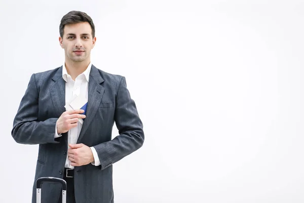 Businessman taking travel documents out of the inner pocket of his jacket. — Stock Photo, Image