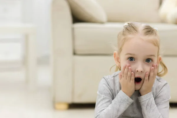 Close-up portrait of a little amazing girl with open mouth isolated on white. — Stock Photo, Image