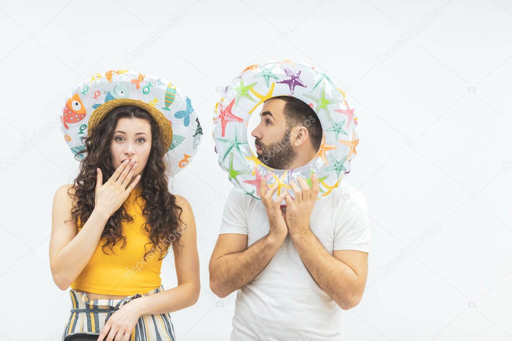 Young man and woman couple holding ring buoy float lifesaver equipment having fun.