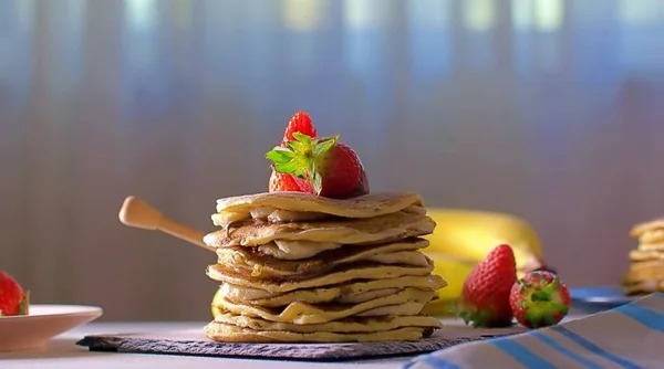 American pancakes with chocolate strawberries and banana Royalty Free Stock Photos