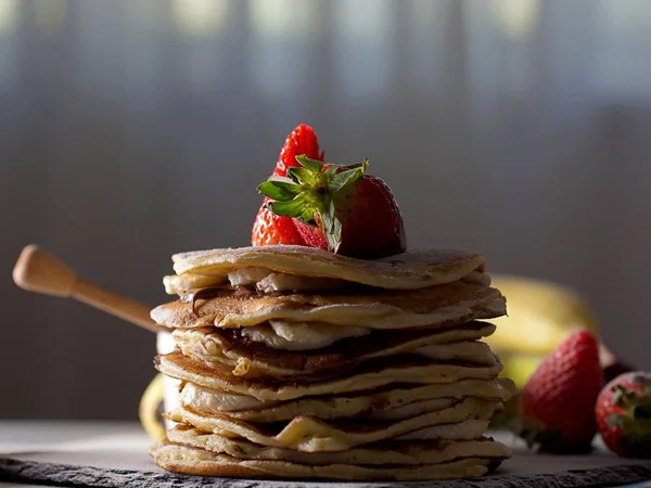 American pancakes with chocolate strawberries and banana Stock Image