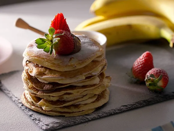 American pancakes with chocolate strawberries and banana Stock Image