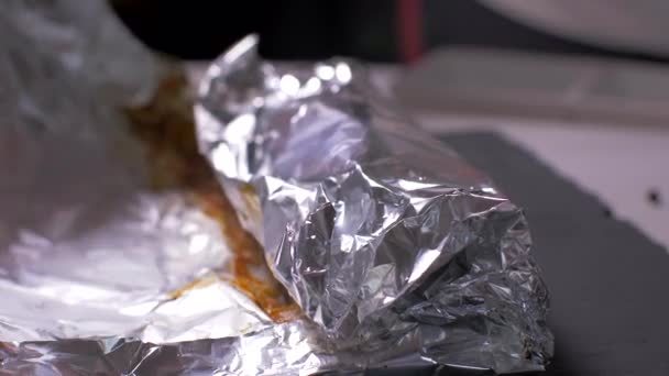 Salmon cooked in foil removed from the oven — Stock Video