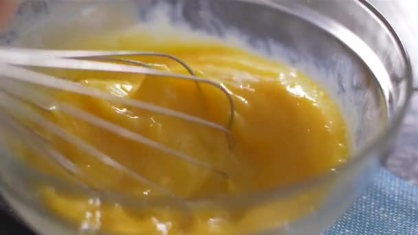 Beating of eggs in a bowl. Slow motion. — Stock Video