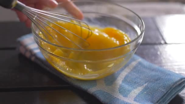 Beating of eggs in a bowl. Slow motion. — Stock Video